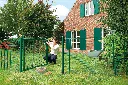 LAKZP1_SKRZ_GBM12_LOCITOOL__Woman_installing_on_green_garden_gate__1920px.webp